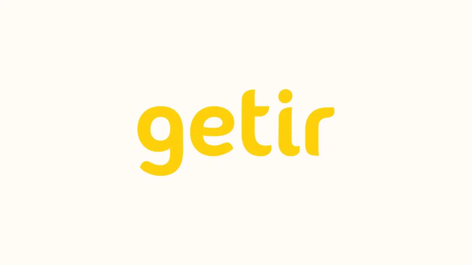 Beyaz arka planda sarı renkle yazılmış Getir logosunun yakın görüntüsü.