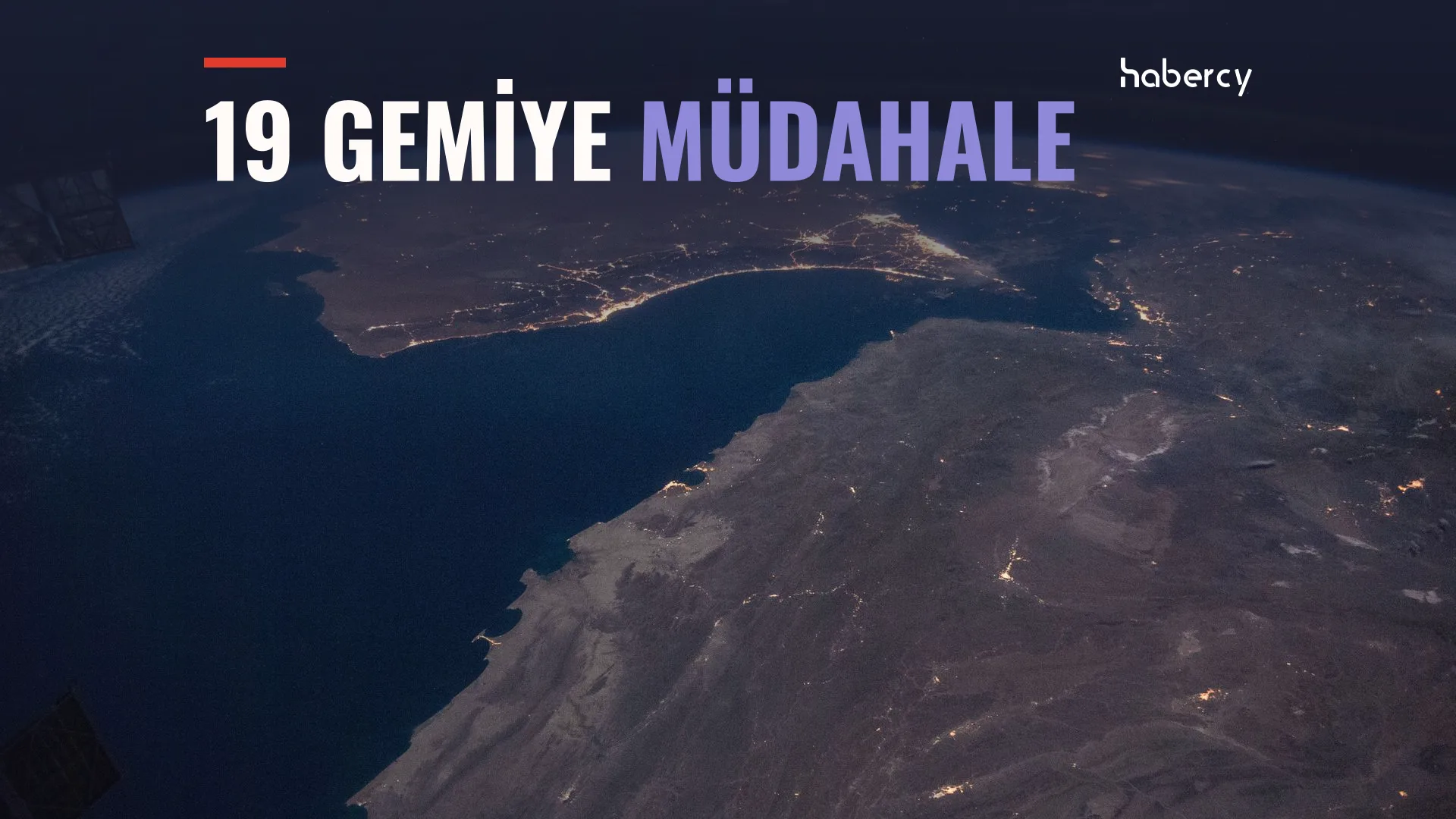 Uzaydan gece çekilmiş, ışıklı kıyı şeritleriyle Umman Körfezi ve Hürmüz Boğazı