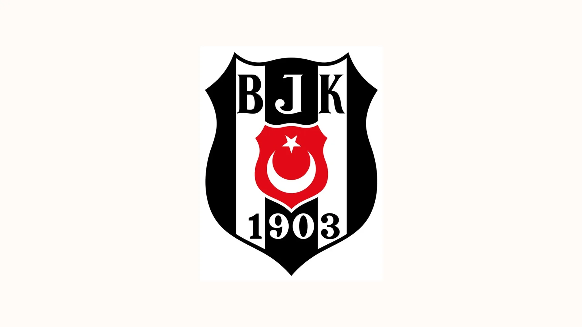 Siyah beyaz çizgili kalkan içinde BJK harfleri, ay yıldız ve 1903 yazan arma.