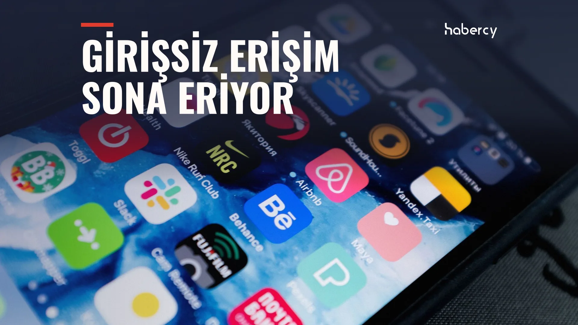 Akıllı telefon ekranında Slack, Airbnb, Behance gibi uygulama simgeleri